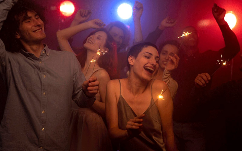 friends laughing together at a club, night out transport, October 2024, Australia