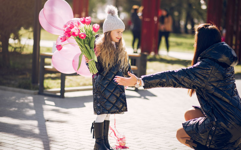 Vibrant tulip beds in full bloom at Floriade Canberra with visitors strolling through Commonwealth Park